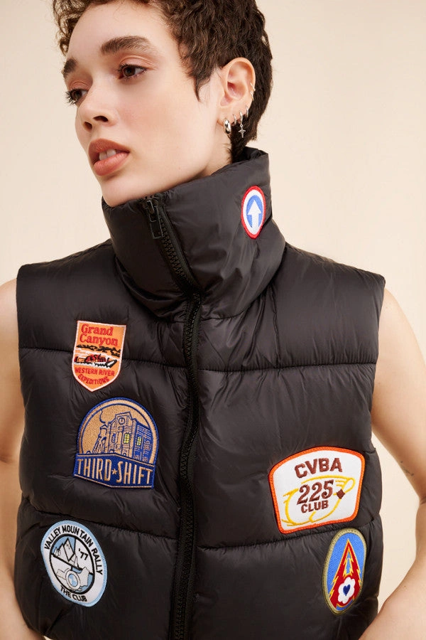 Cozy Patches Puffer Vest: Your New Go-To for Cool Days.